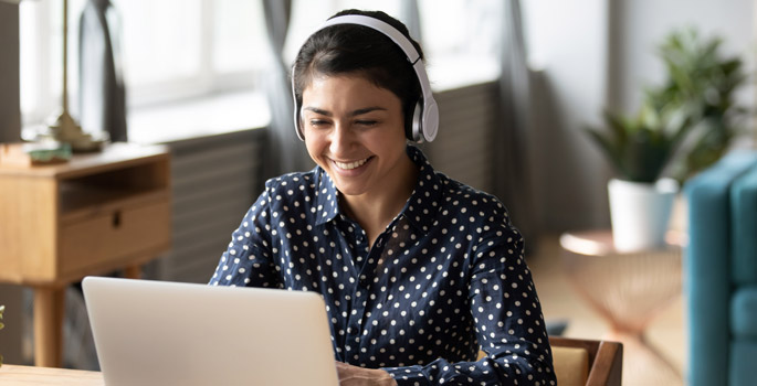 Image of person using Webex calling on a computer with a headset
